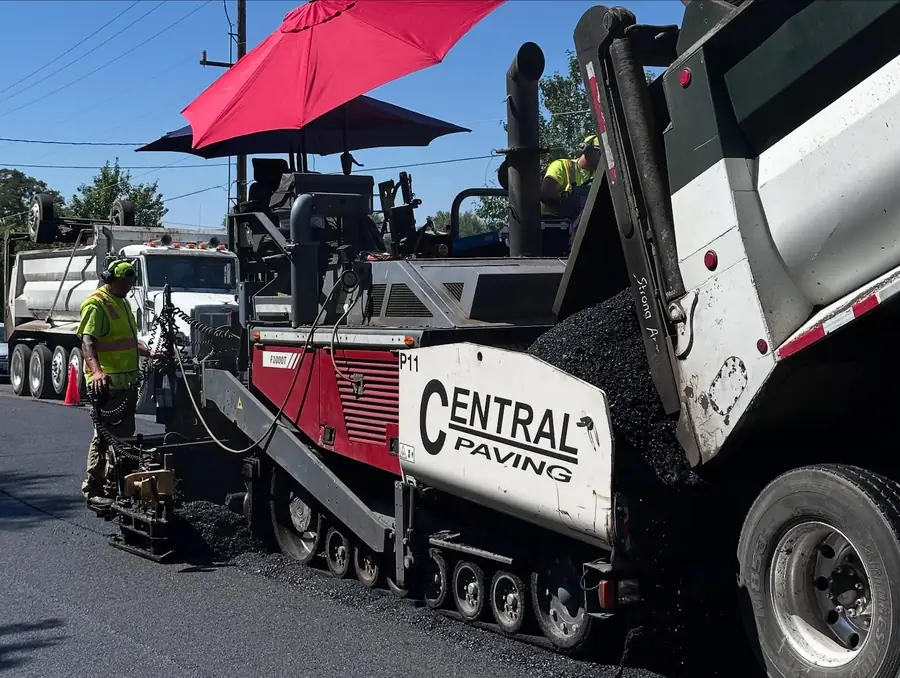 Red Central Paving paver on a job site