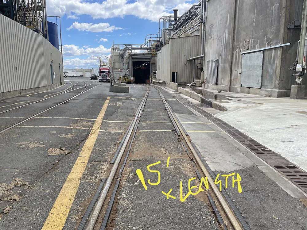 Rail tracks with painted layout markings inside the mill