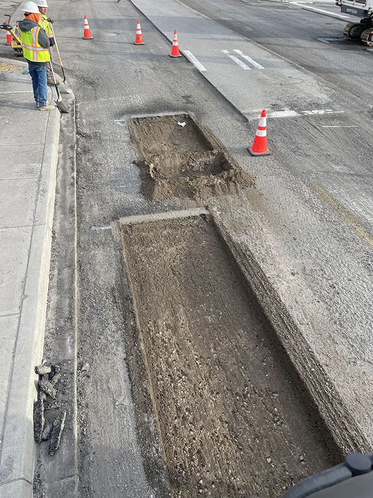 Excavated repair area in the roadway on Walla Walla Avenue