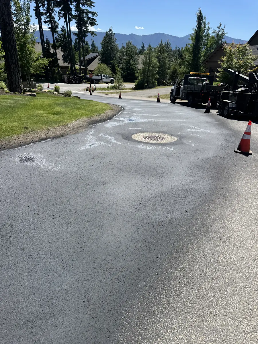 Manhole cover in a paved neighborhood street