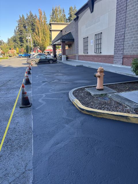 Retail center in Edmonds, WA: crack seal and sealcoat (photo 2)