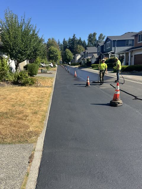 HOA community in Mill Creek, WA: patching, sealcoat and striping (photo 1)