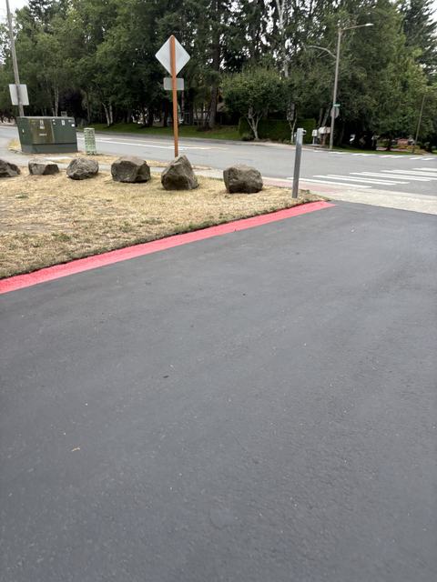 HOA parking lot in Mill Creek, WA: sealcoat and curb striping (photo 2)