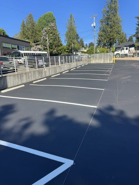 Retail lot in Seattle, WA: crack seal, sealcoat and striping (photo 1)