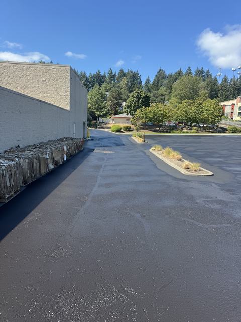 Retail center in Silverdale, WA: crack seal, sealcoat and striping (photo 1)