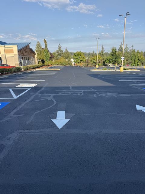 Retail center in Silverdale, WA: crack seal, sealcoat and striping (photo 2)
