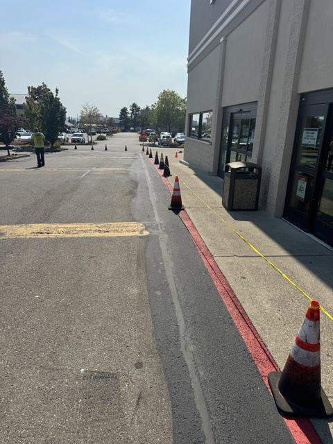 Retail center in Silverdale, WA: crack seal, sealcoat and striping (photo 3)