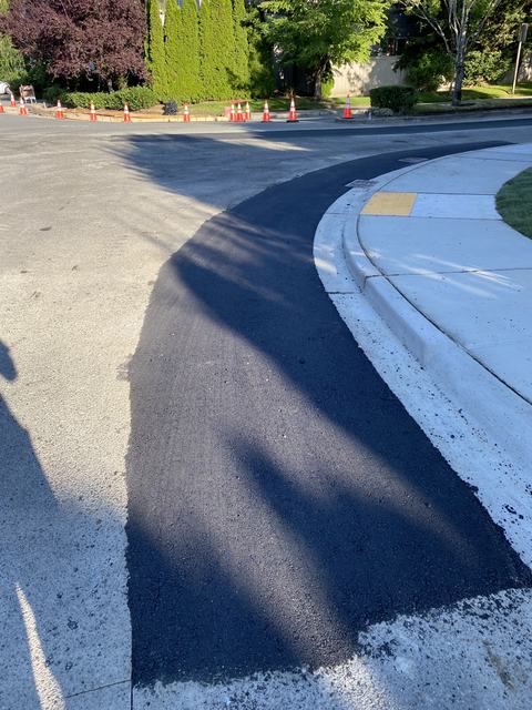 Neighborhood street in Snohomish County, WA: street restoration with new curb and paving (photo 1)