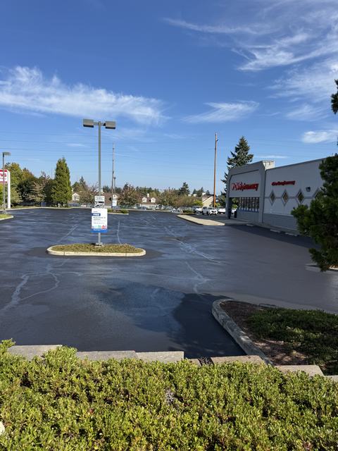 Retail center in Tacoma, WA: crack seal, sealcoat and striping (photo 2)
