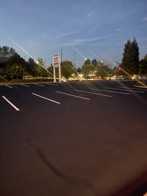 Retail center in Tacoma, WA: crack seal, sealcoat and striping (photo 3)